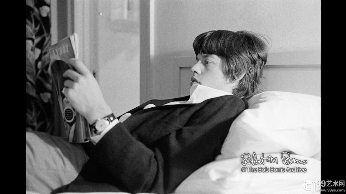 Mick Jagger reads Playboy magazine, Los Angeles, May 1965