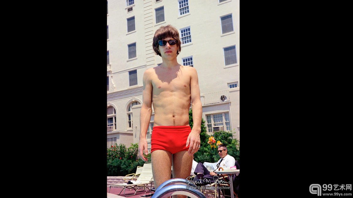 Mick Jagger poolside in red swimsuit and sunglasses, Clearwater, Florida, May 7, 1965