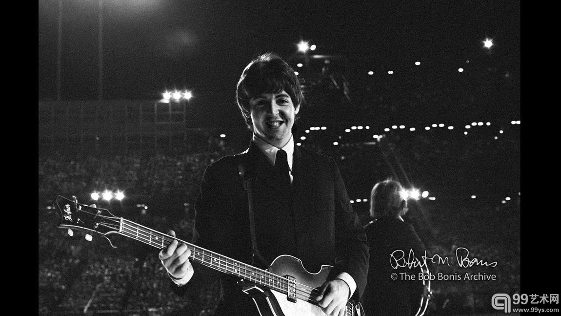 Paul McCartney plays against the crowd, Bloomington, Minn., August 1965