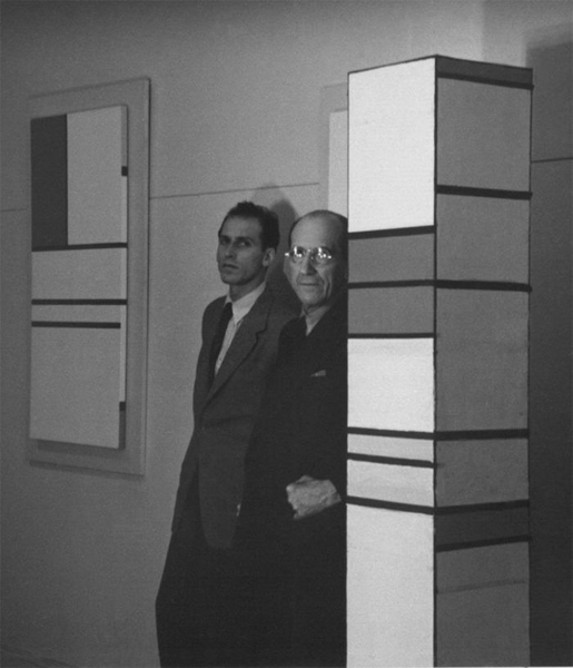 Harry Holtzman standing with Piet Mondrian, Holtzman’s studio, New York City, 1941