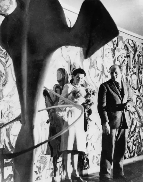 Peggy Guggenheim and Jackson Pollock in front of Mural(1943), New York, ca. 1946. Photo: Gorge Karger
