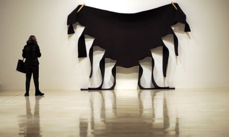 visitor looks at an untitled work by Robert Morris, included in Guggenheim Collection: The American Avant-Garde 1945-1980 in Rome in 2012