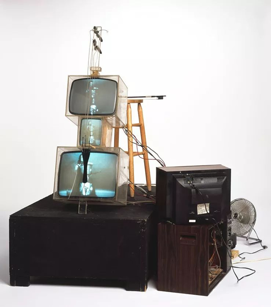 Nam June Paik, TV Cello, 1971, video tubes, TV chassis, Plexiglas boxes, electronics, wiring, wood base, fan, and photograph, dimensions variable. Photo: courtesy Walker Art Center
