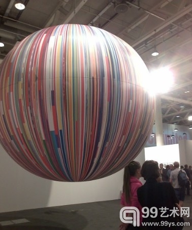 Resembling a planet orbiting around a star, Meschac Gaba’s Citoyen du Monde: balloon (2013) 